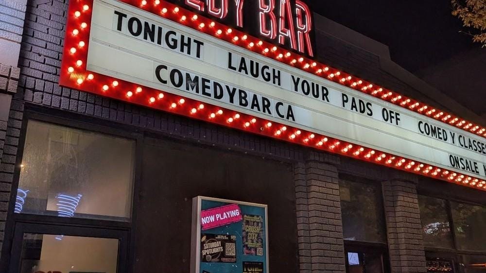 Comedy Bar marquee glowing at night on Bloor Street West Stand-up, improv and late shows on one schedule