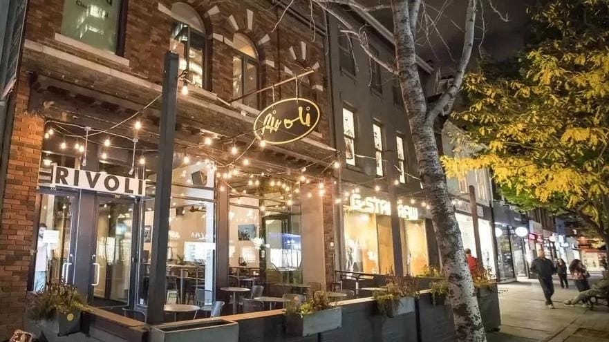 Rivoli exterior and patio lights at night on Queen Street West Concerts, dance parties, comedy and pool on Queen West