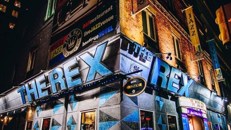 The Rex jazz club exterior lit in blue at night Daily jazz with matinees, dinner sets and late shows