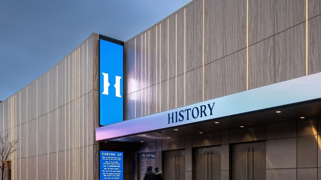 Curved exterior of the HISTORY concert venue in Toronto A large concert hall with a clear event-night focus